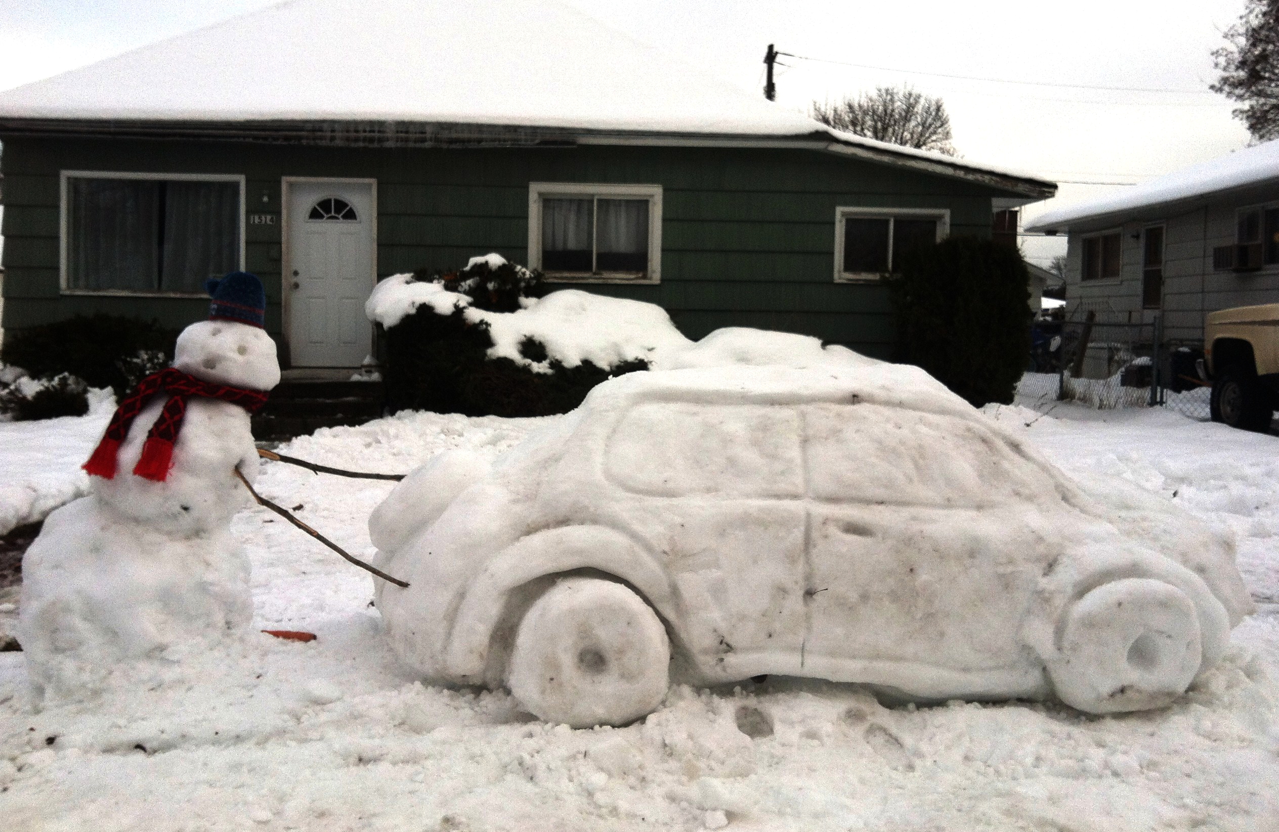 A car made out of snow in front on an Idaho home